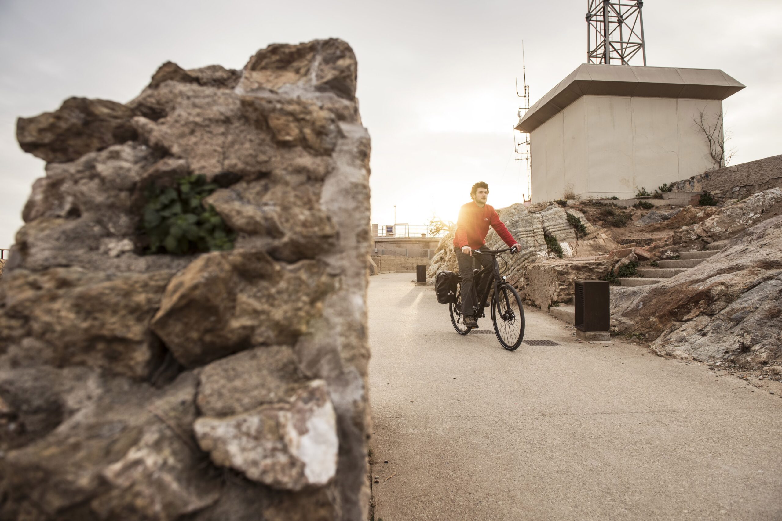 Man biking in an asphalt side road Man biking in an asphalt side road
