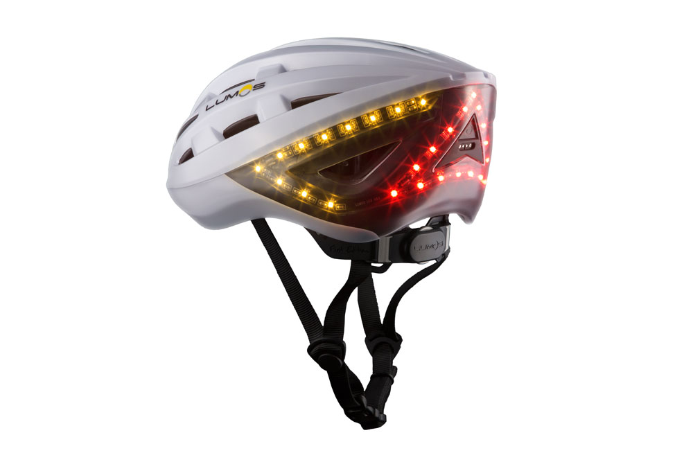 White Lumos Kickstart bike helmet profile with rare lights on White Lumos Kickstart bike helmet profile with rare lights on