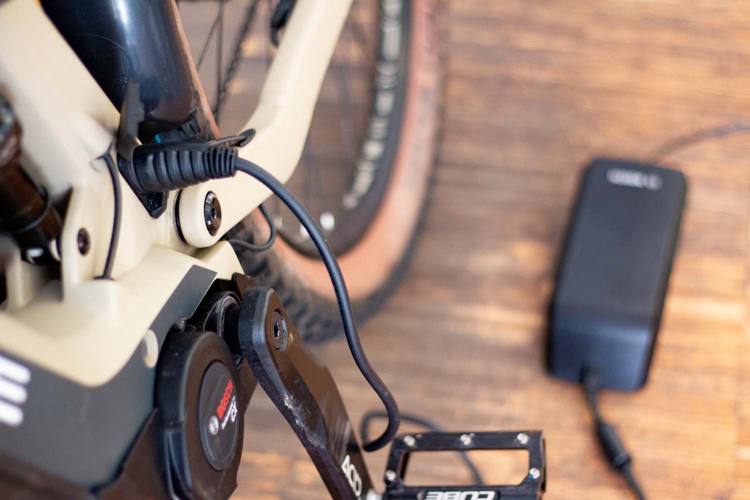 The Bosch battery stays in the frame while charging The Bosch battery staying in the bike frame while charging