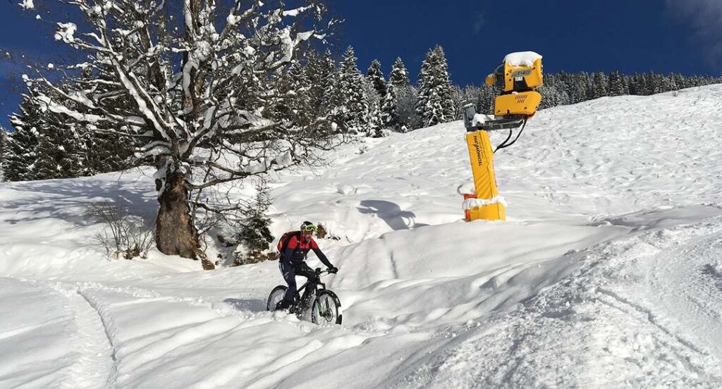 Man cycling in the snow